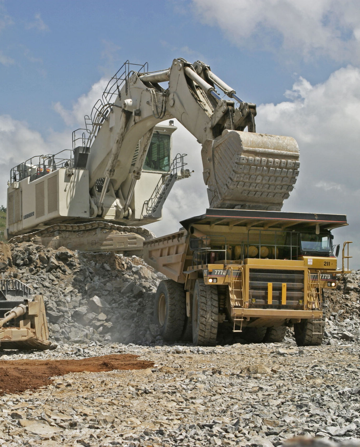 Dumper truck being filled with gold ore body for transport